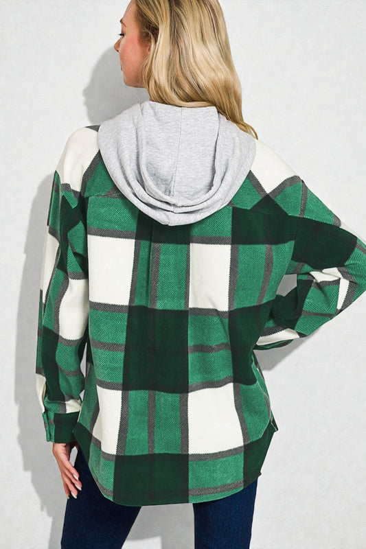 Person wearing a green and white checkered hoodie with a gray hood on a white background