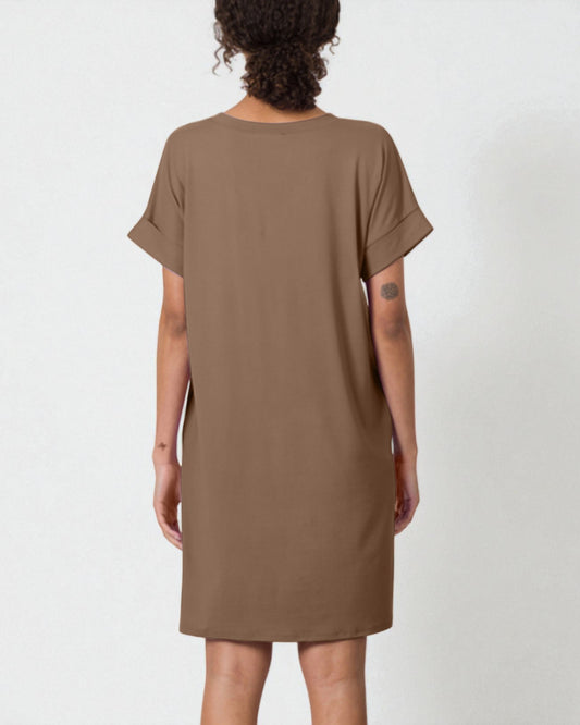 Brown dress worn by a person on a white background