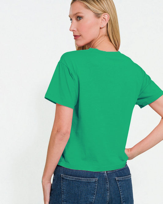 Woman wearing a green t-shirt on a white background