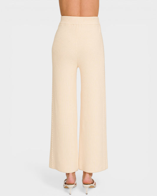 Beige wide-leg pants on a white background