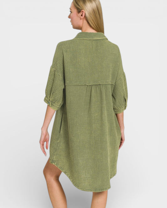 Woman wearing a green checkered dress on a white background