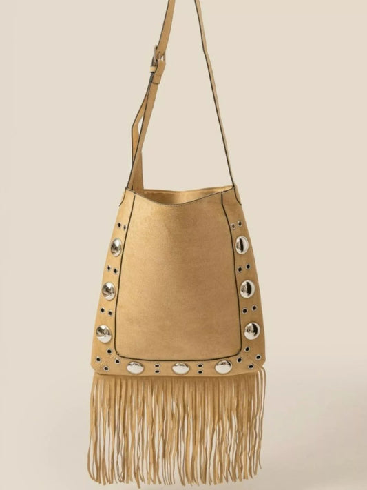 Beige handbag with fringe and stud details on a beige background