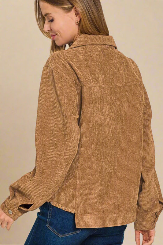 Woman wearing a brown corduroy jacket on a beige background