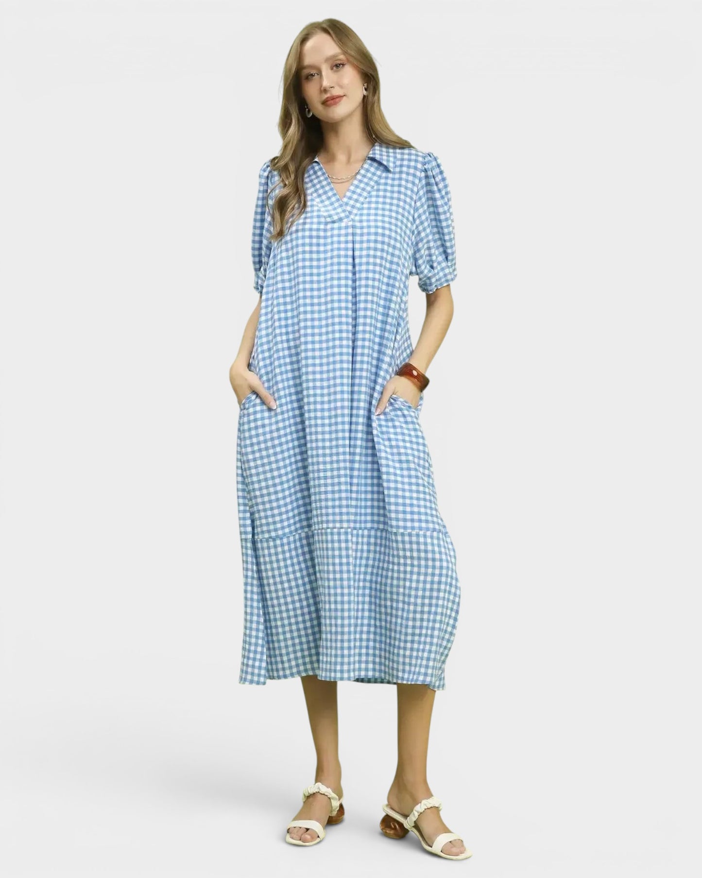 Beach Rose Co. blue and white gingham midi dress with collared split neckline, puff sleeves, and ruffle hem.