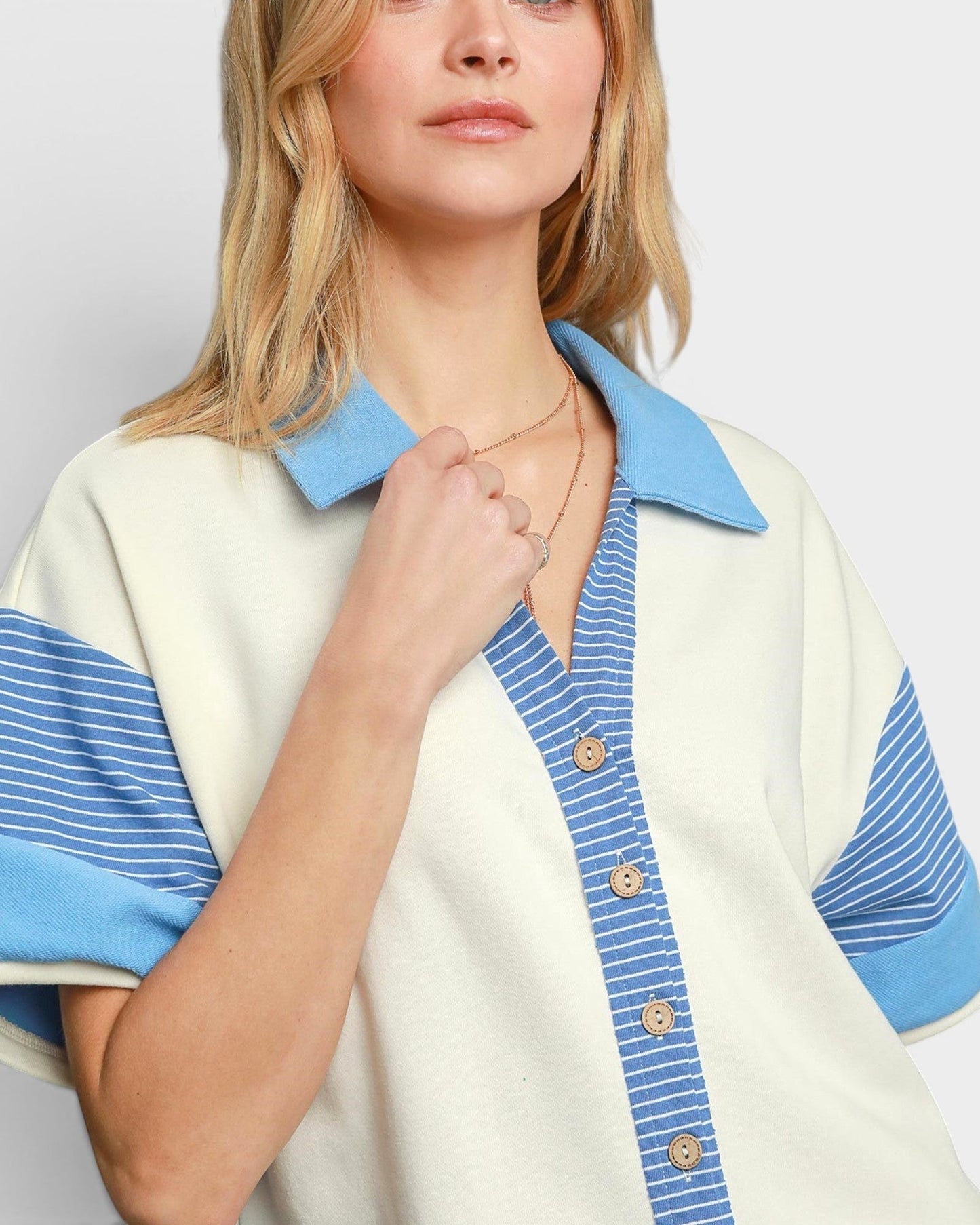 Beach Rose Co. Ivory and blue striped cotton-blend romper with collared neckline and button front.