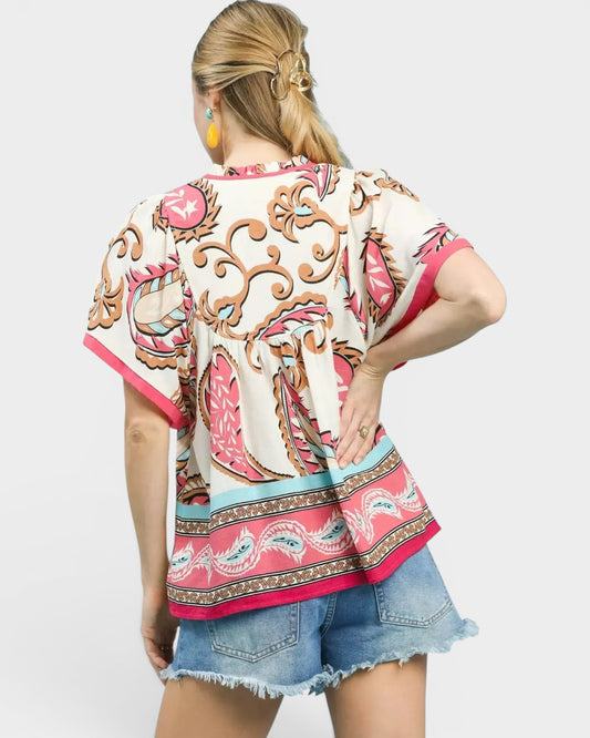 Beach Rose Co. Ivory and pink paisley border print rayon top with split neckline and wide short sleeves.