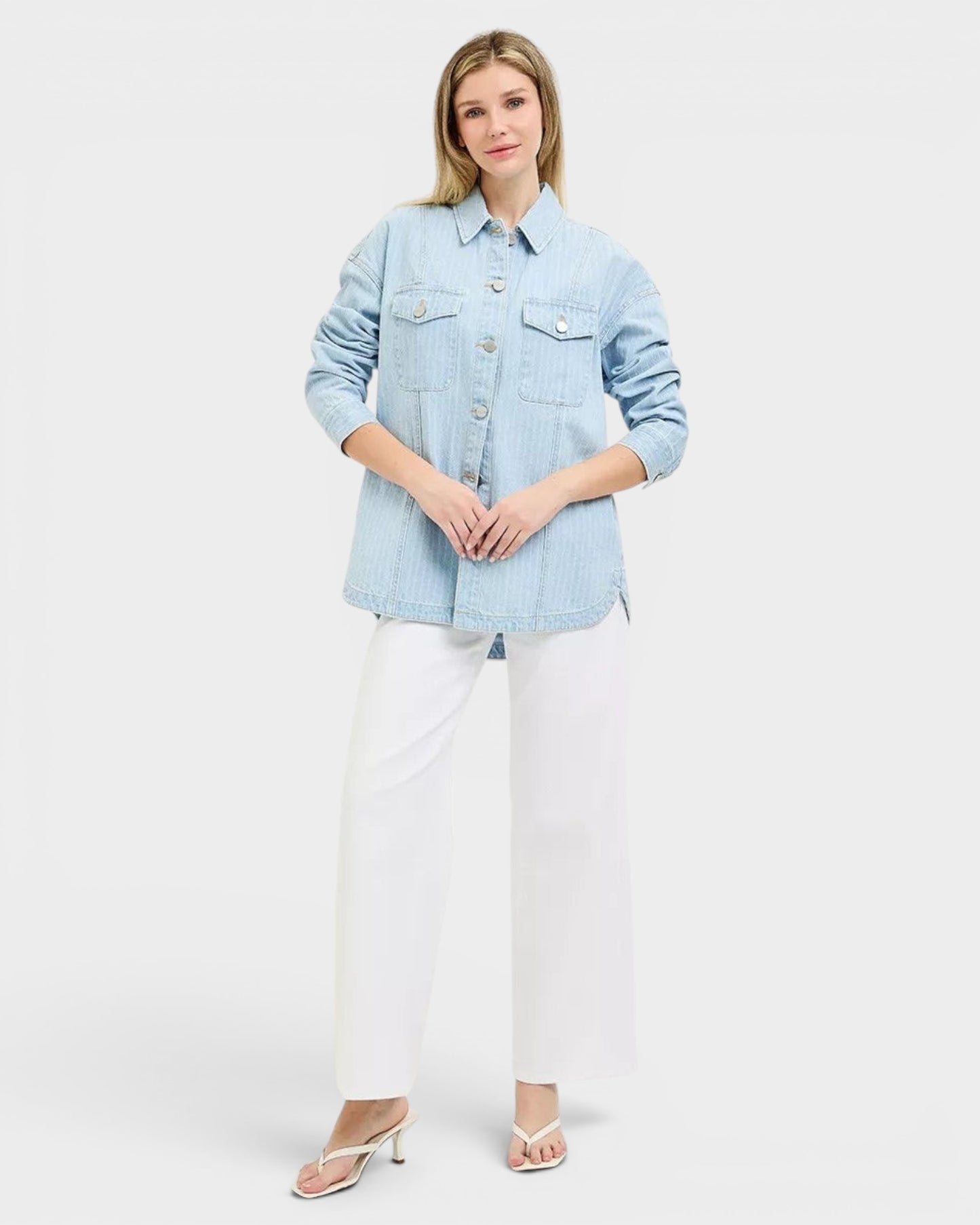 Beach Rose Co. light wash denim jacket with subtle vertical stripes, collared neckline, button front, and chest pockets. 100% cotton.