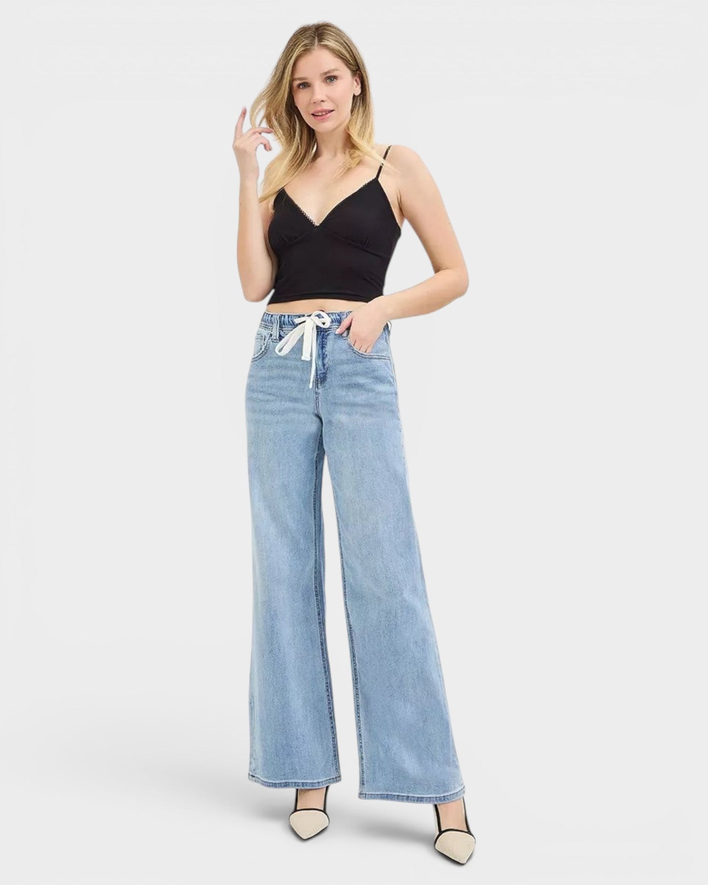Beach Rose Co. light wash denim wide leg jeans with drawstring waist and pockets. Relaxed fit for casual wear.
