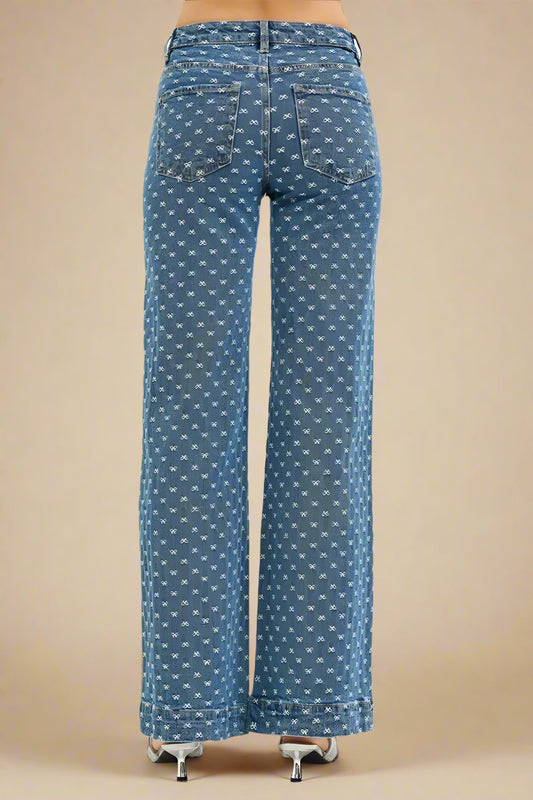 Blue patterned jeans on a beige background