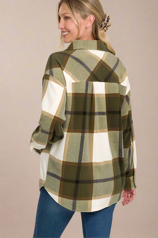 Woman wearing a plaid shirt with a visible brand name on a beige background