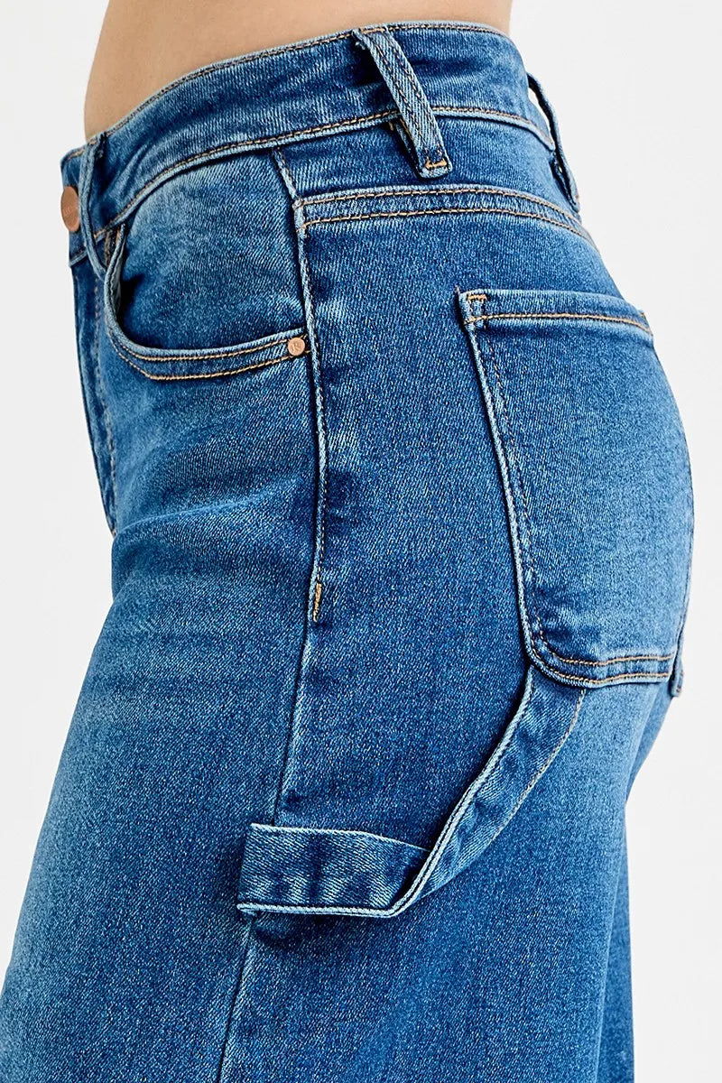 Close-up of blue jeans with a plain background