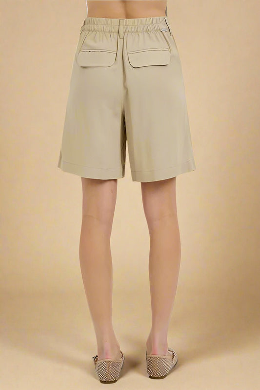 RISEN - High Rise Pleated Shorts in Tan