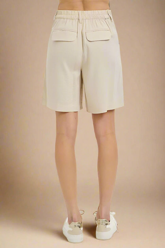 RISEN - High Rise Pleated Shorts in Taupe
