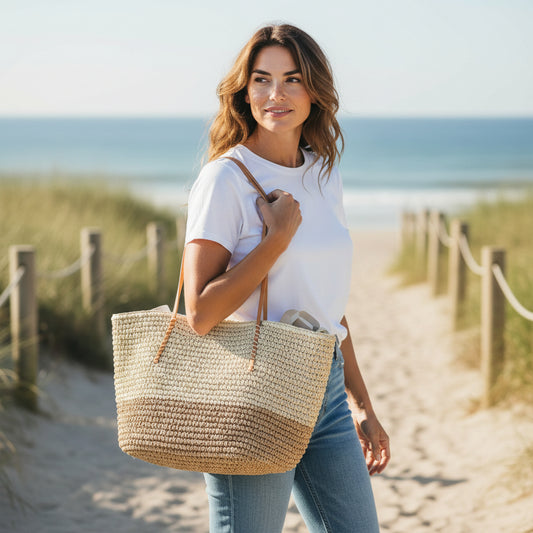 Woman holding a straw bag on a beach