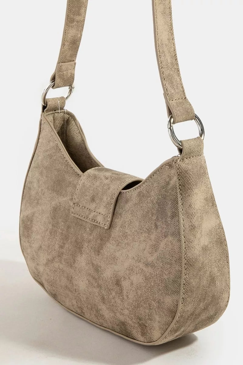 Beige handbag with a strap on a white background