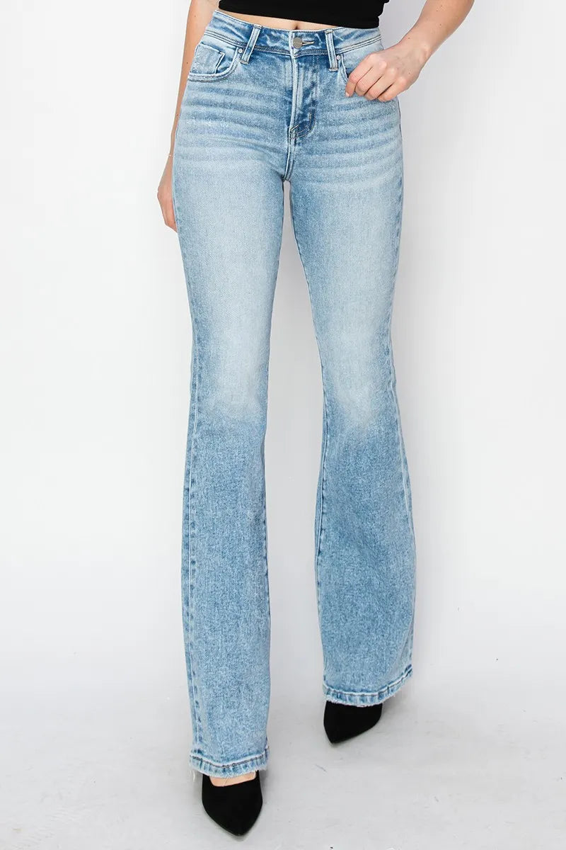 Light blue jeans worn by a person on a white background