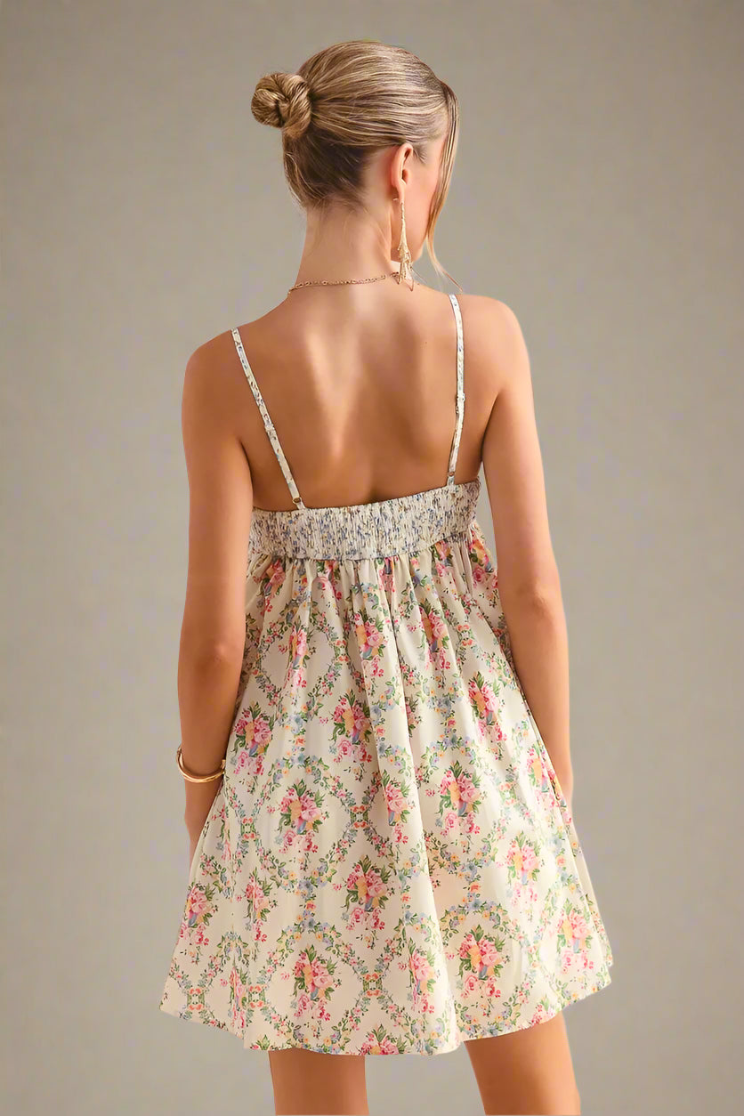 Woman wearing a floral dress against a soft beige background
