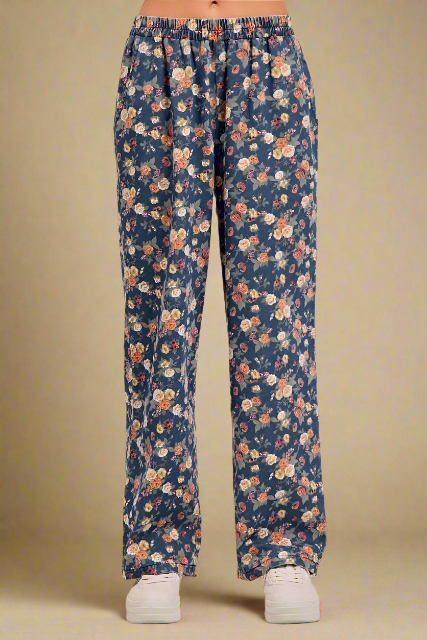Floral patterned pants on a plain background