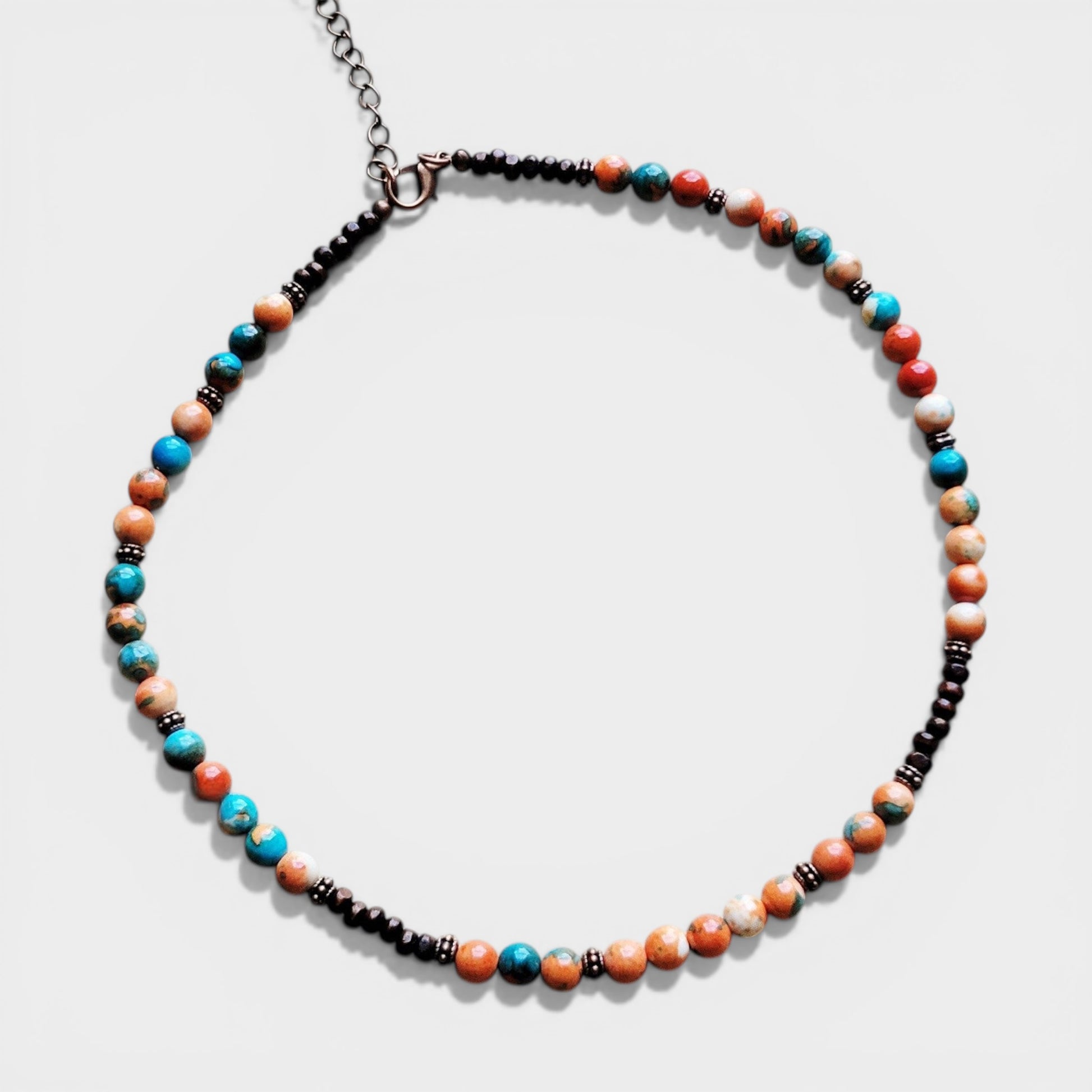 Necklace with multicolored beads on a white background