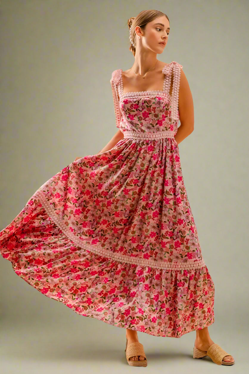 Woman wearing a floral dress against a beige background