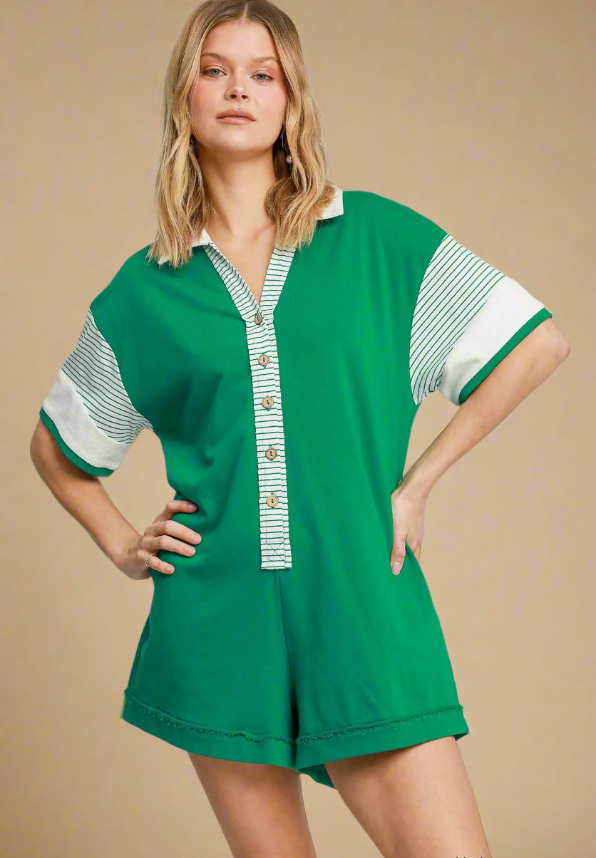 Woman wearing a green and white patterned romper on a beige background