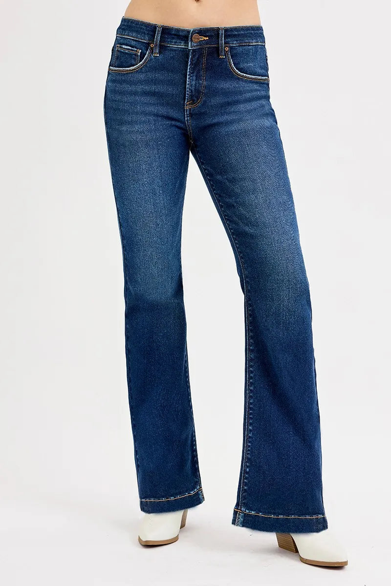 Blue jeans worn by a person on a white background