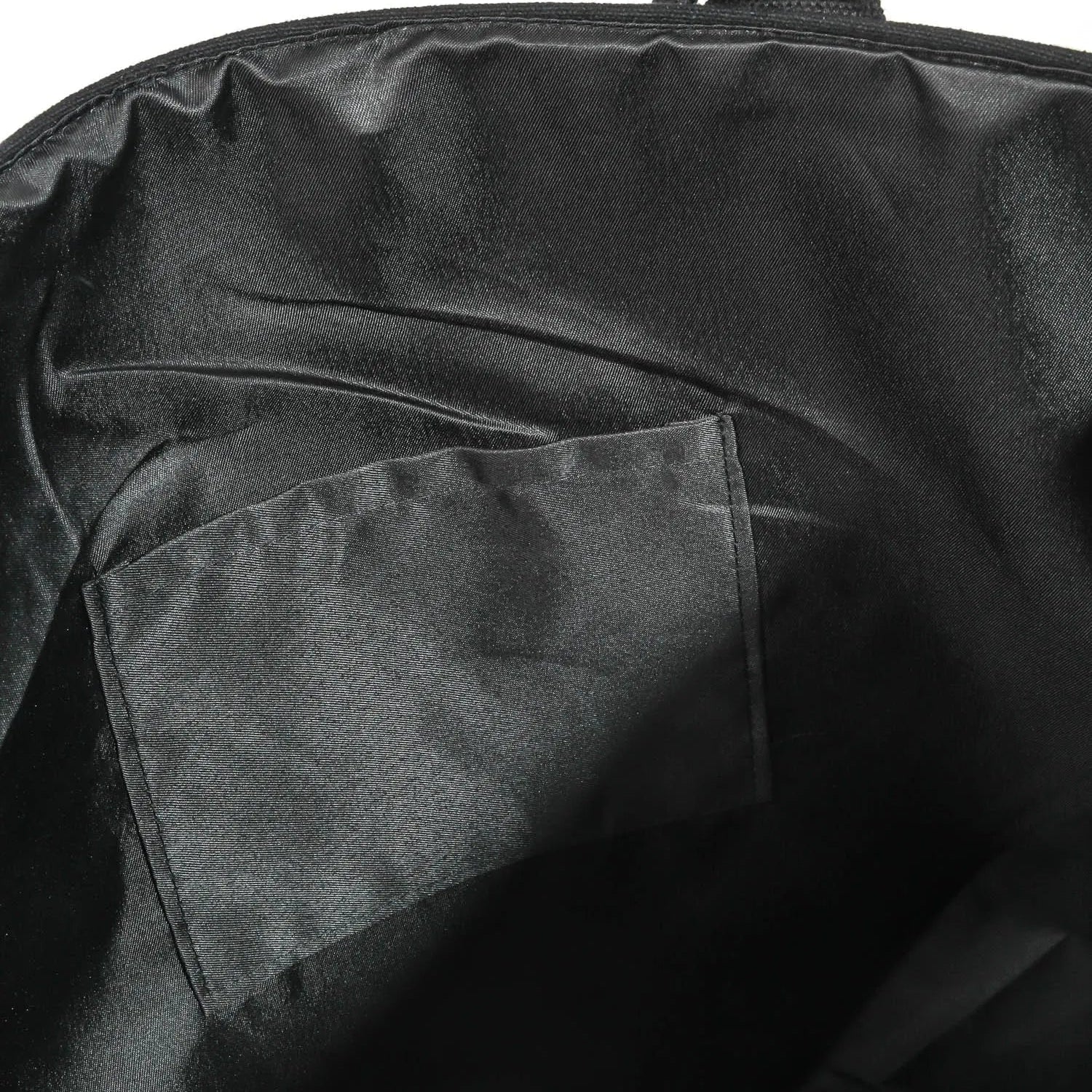 Close-up of a black bag with a pocket on a white background