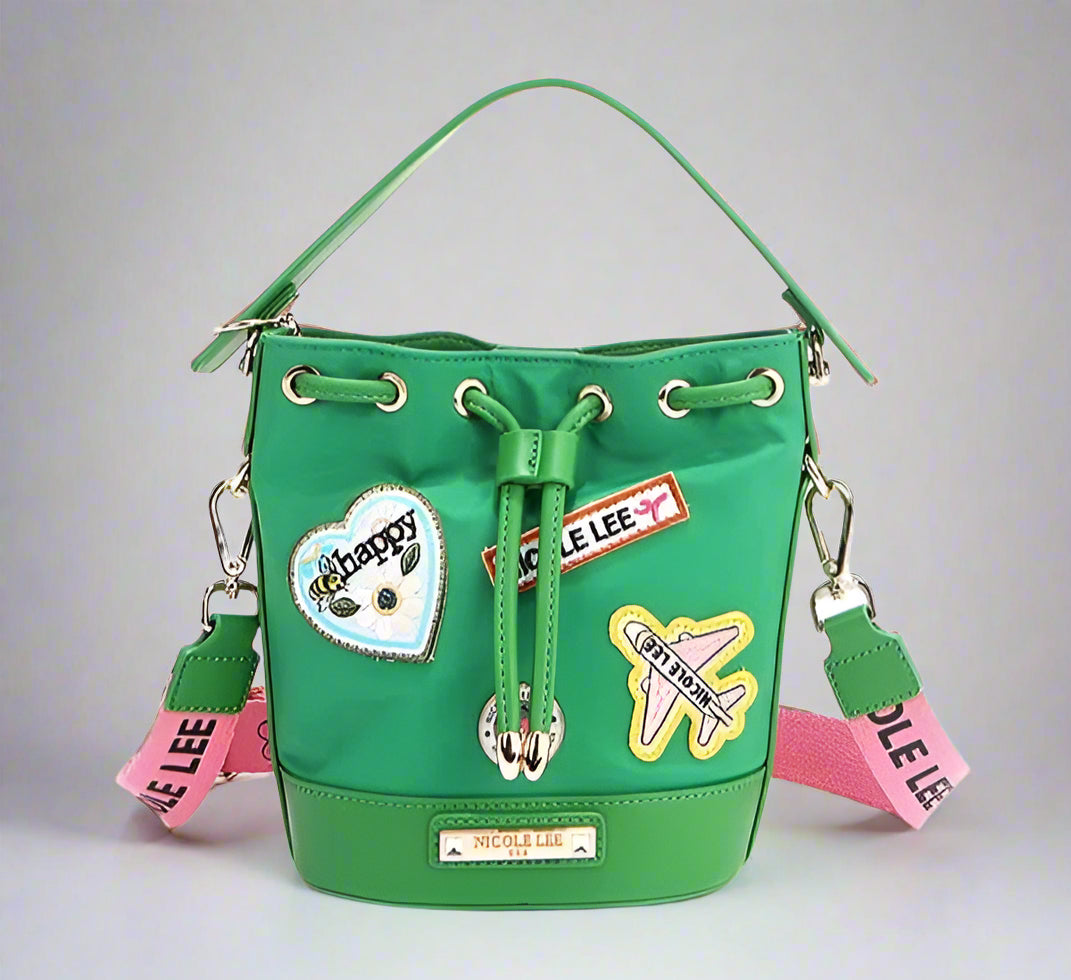 Green bucket bag with patches and drawstring on a white background