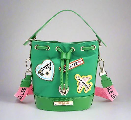 Green bucket bag with patches and drawstring on a white background
