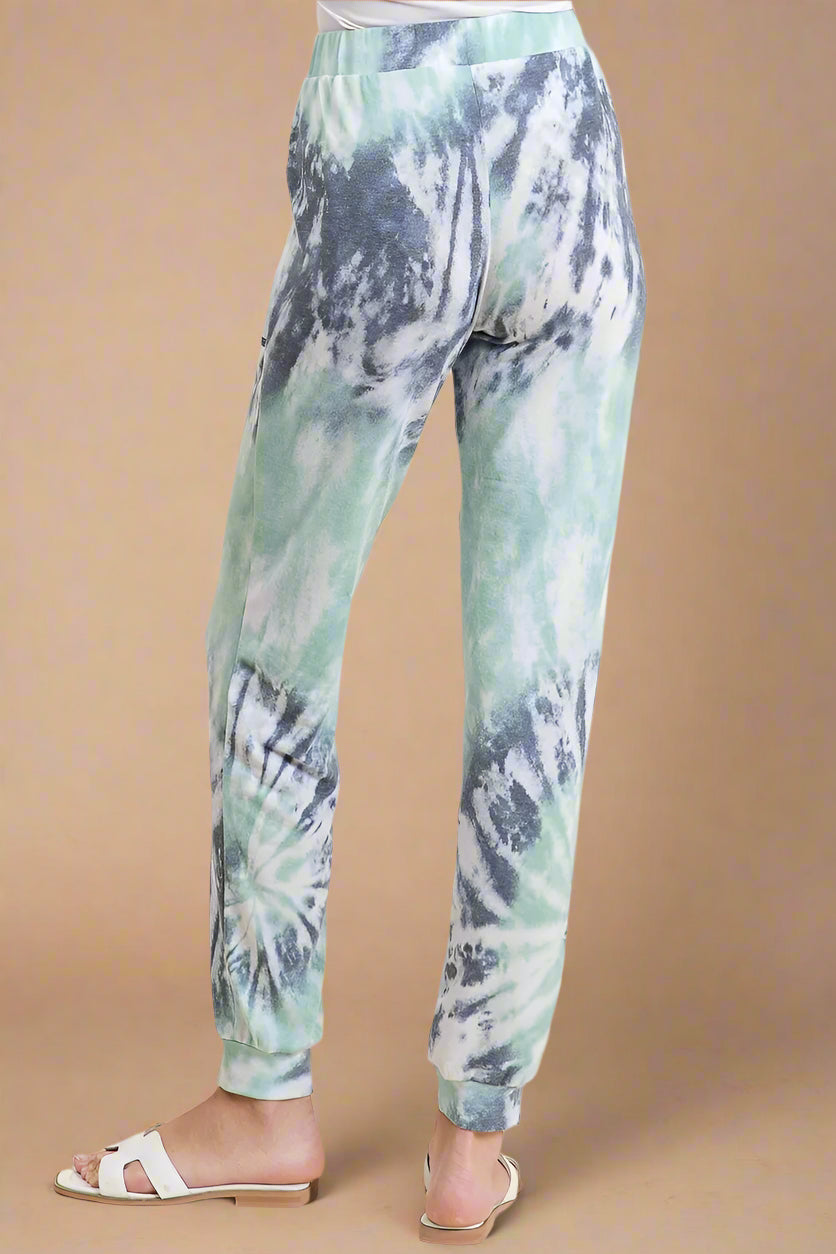 Tie-dye jogger pants on a beige background