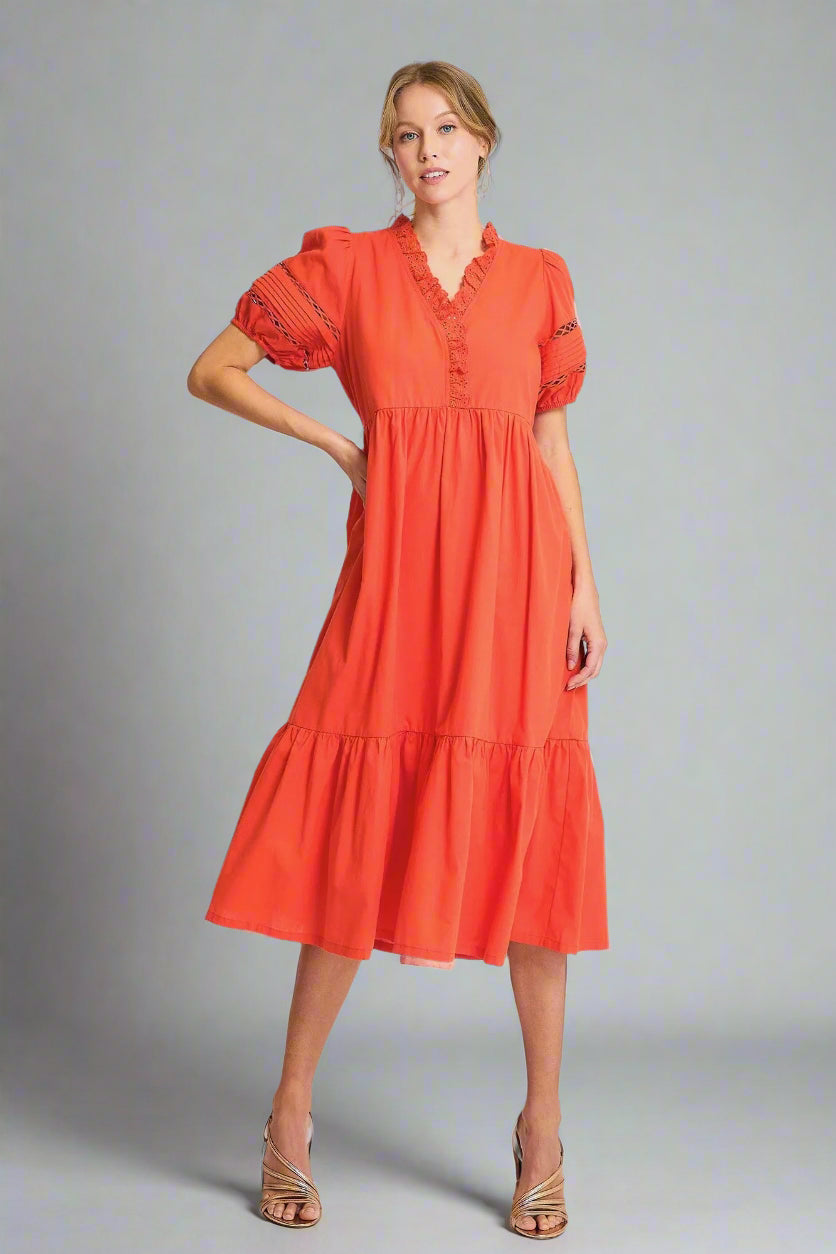Woman wearing a red dress on a white background