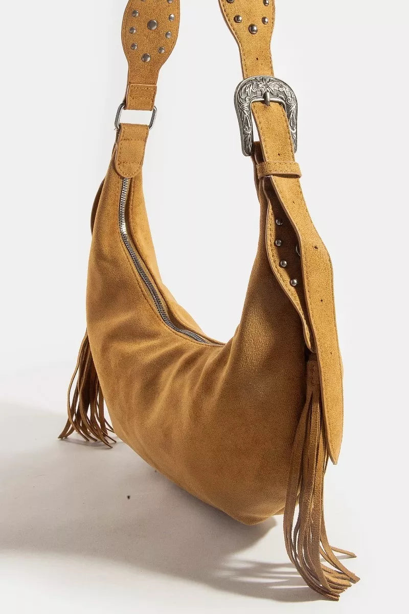 Brown suede handbag with fringes and studded details on a white background