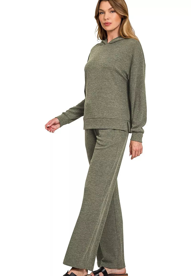 Woman wearing a green lounge set on a white background