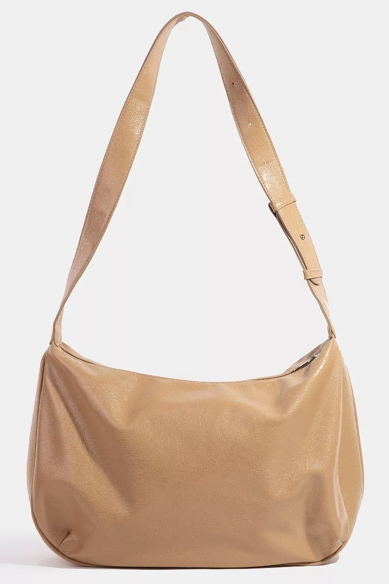 Beige shoulder bag on a white background