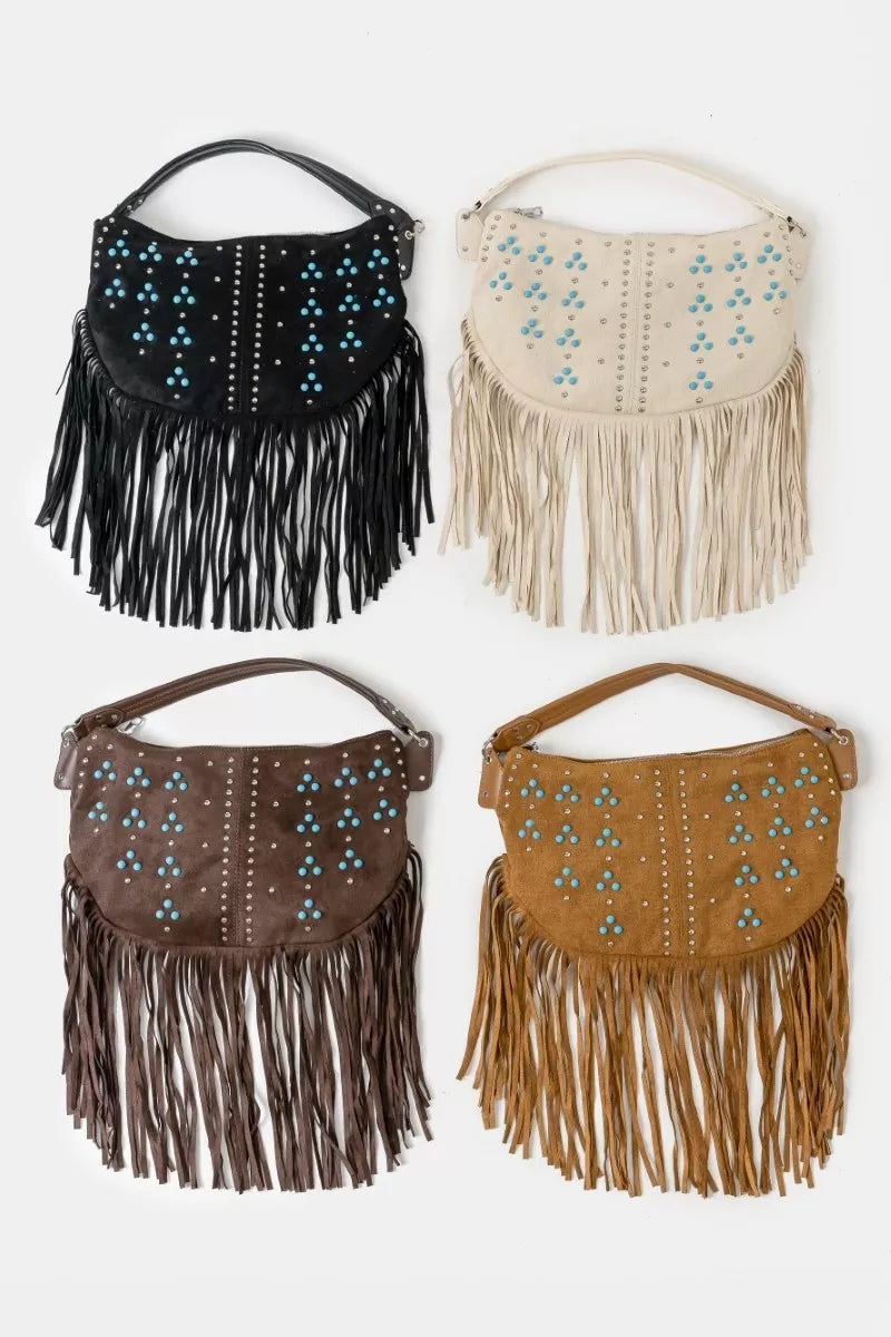 Four fringed handbags in black, beige, brown, and tan on a white background