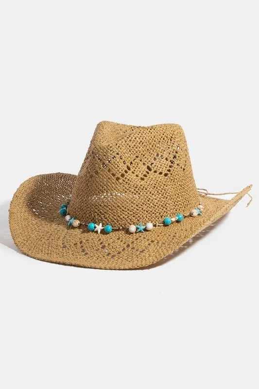 Straw hat with decorative band on a white background