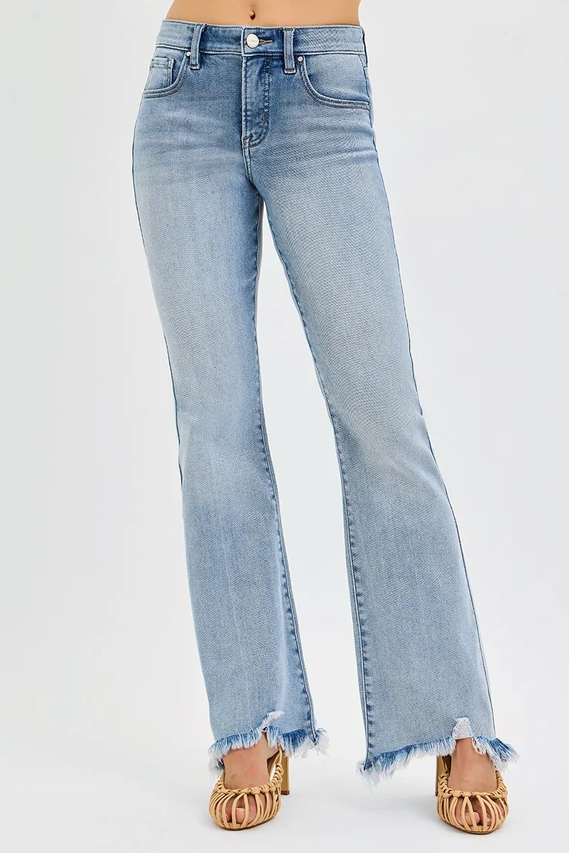Light blue jeans with frayed hems on a white background