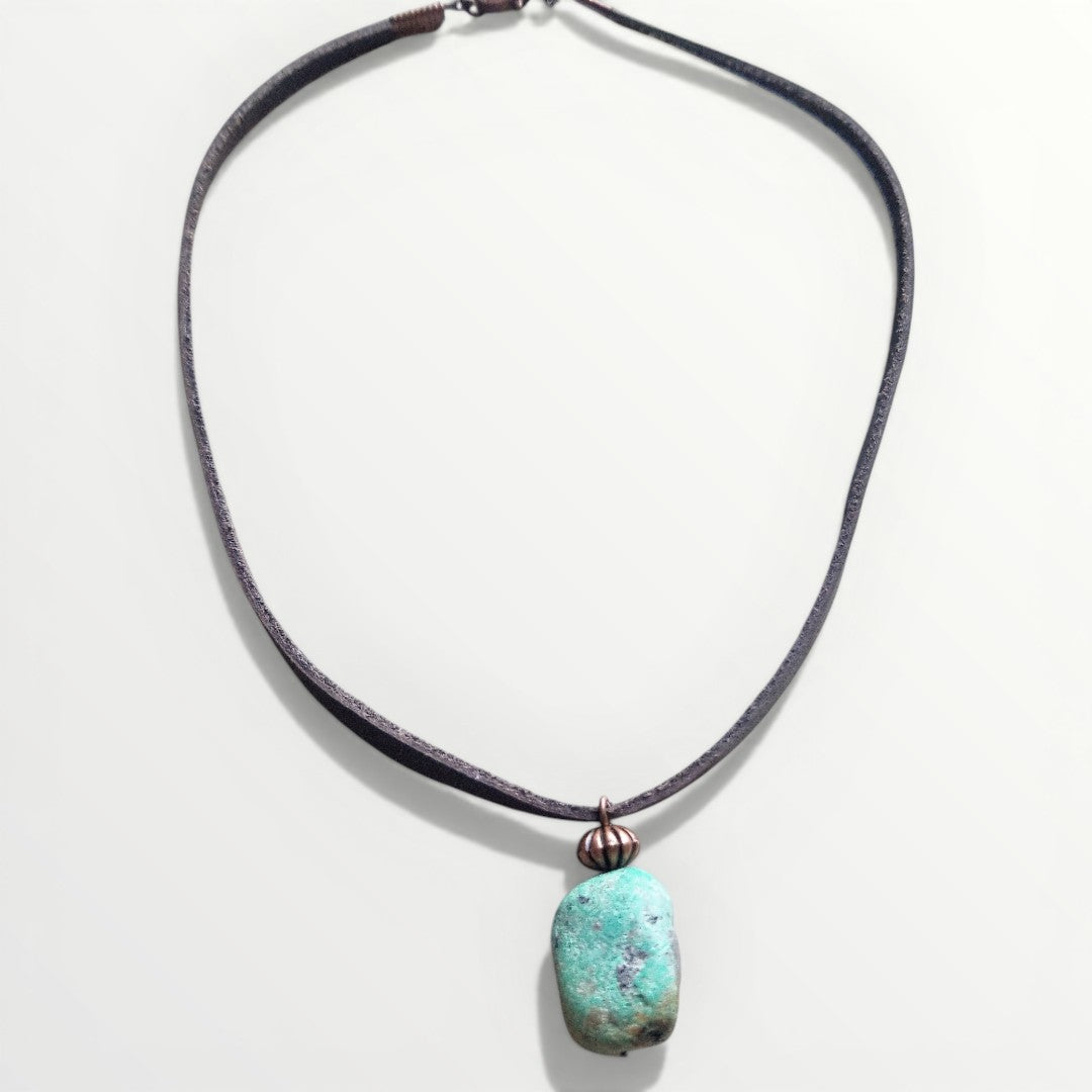 Necklace with a turquoise pendant on a white background