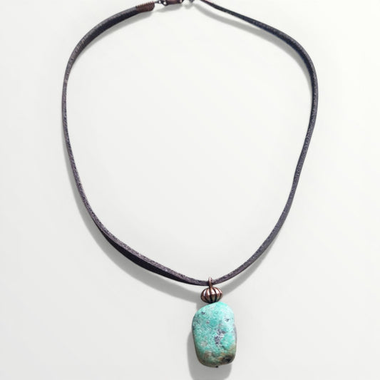 Necklace with a turquoise pendant on a white background