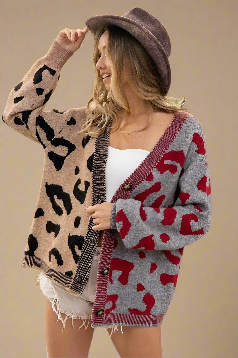 Woman wearing a patterned cardigan with a beige background