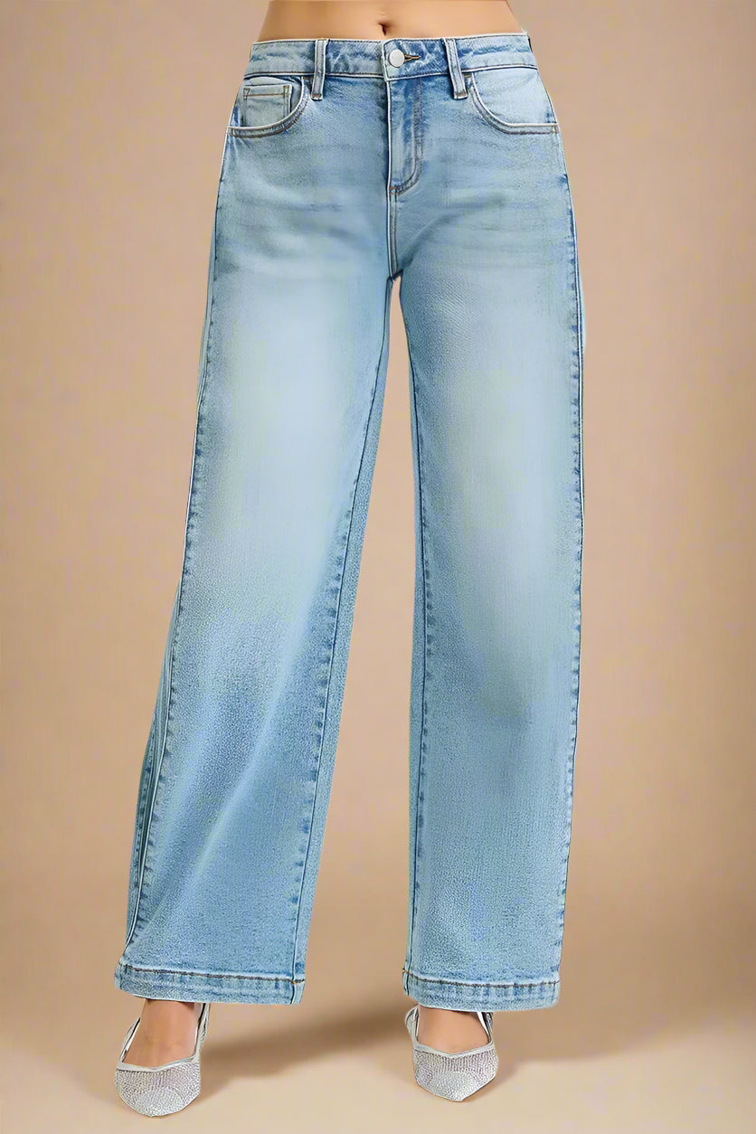 Light blue jeans on a beige background
