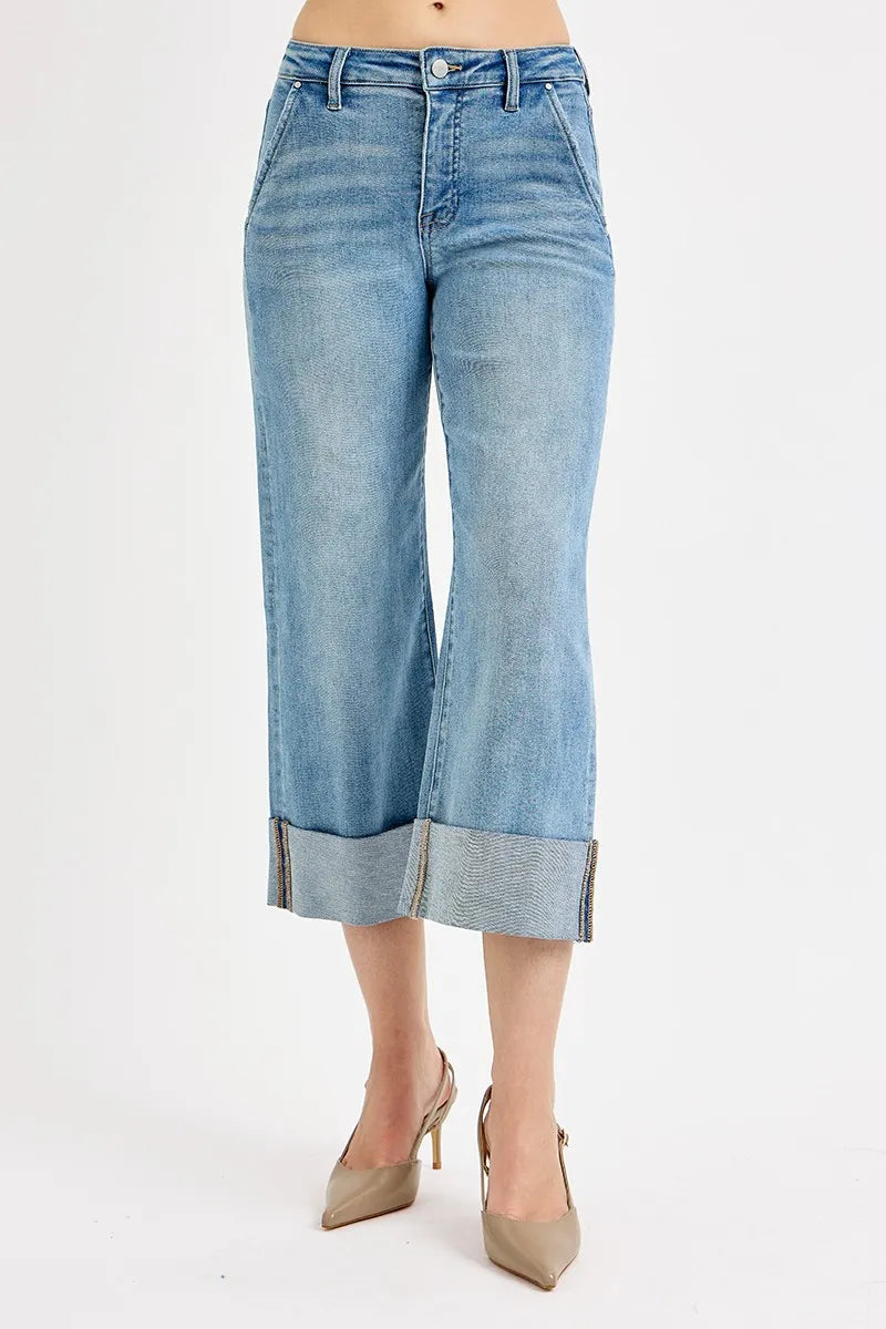 Light blue denim culottes worn by a person on a white background