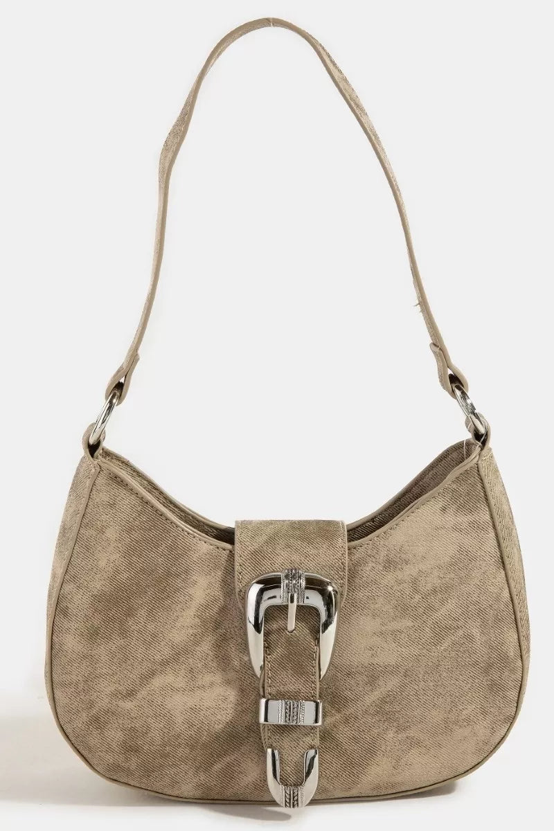 Beige handbag with a silver buckle on a white background