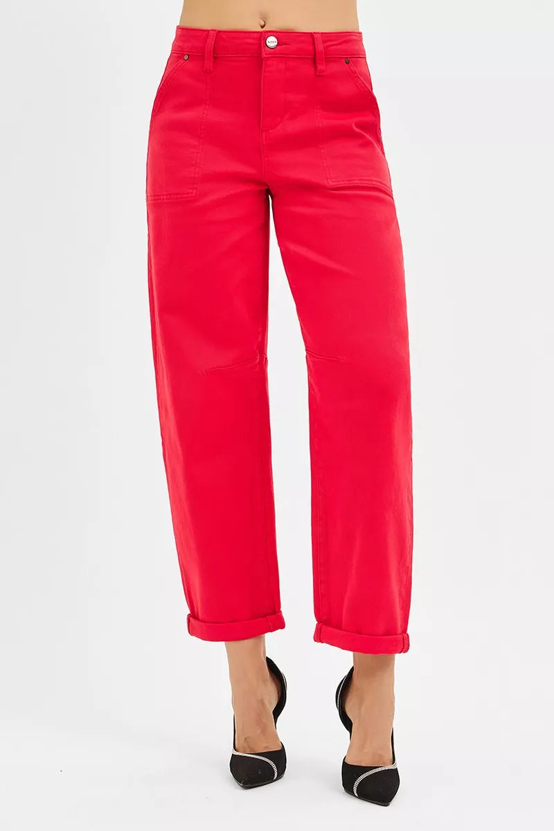 Red pants worn by a person on a white background