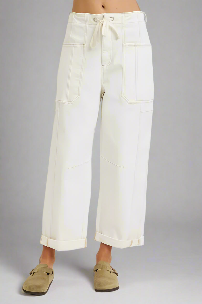 White wide-leg pants worn by a person on a white background