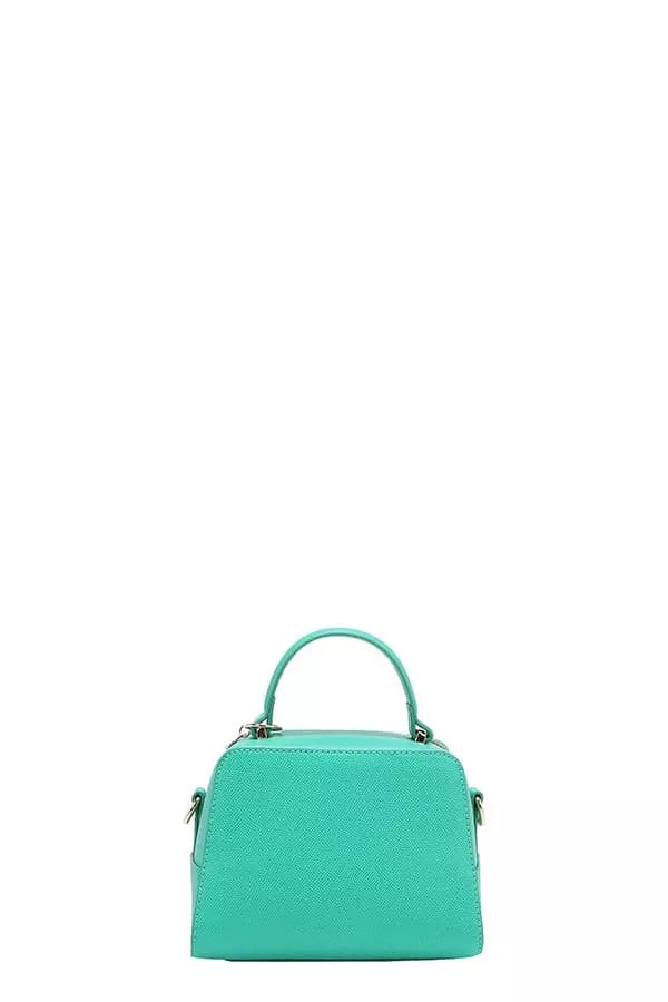 Turquoise handbag on a white background