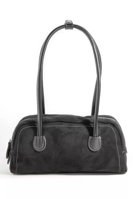 Black handbag with a strap on a white background