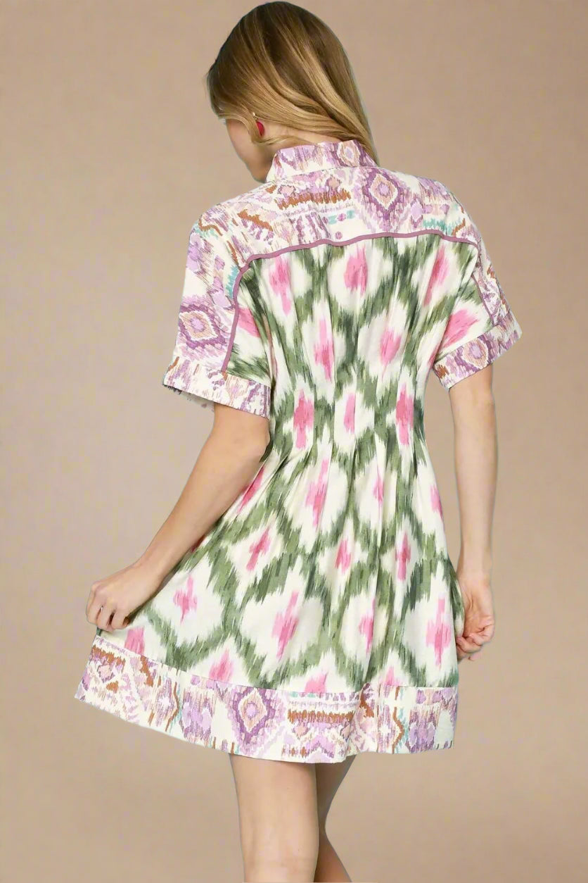 Woman wearing a floral dress with a beige background