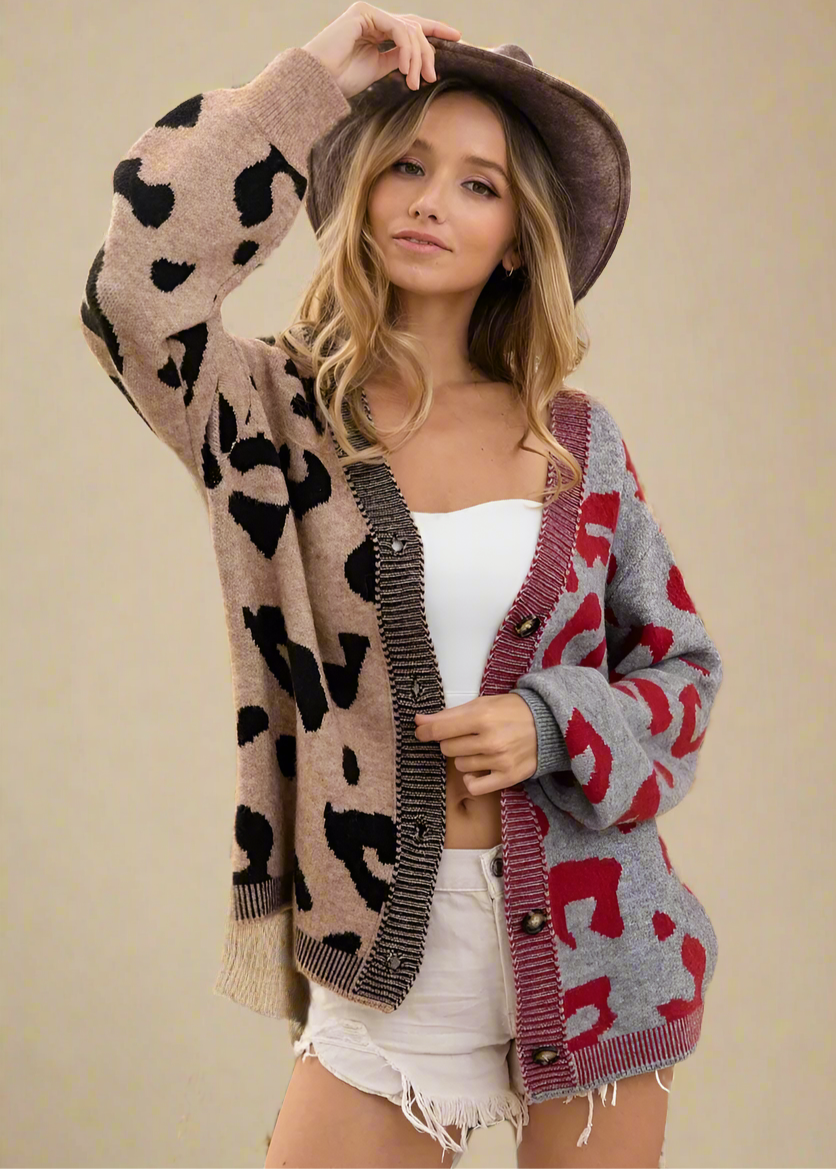 Woman wearing a patterned cardigan with a blurred outdoor background