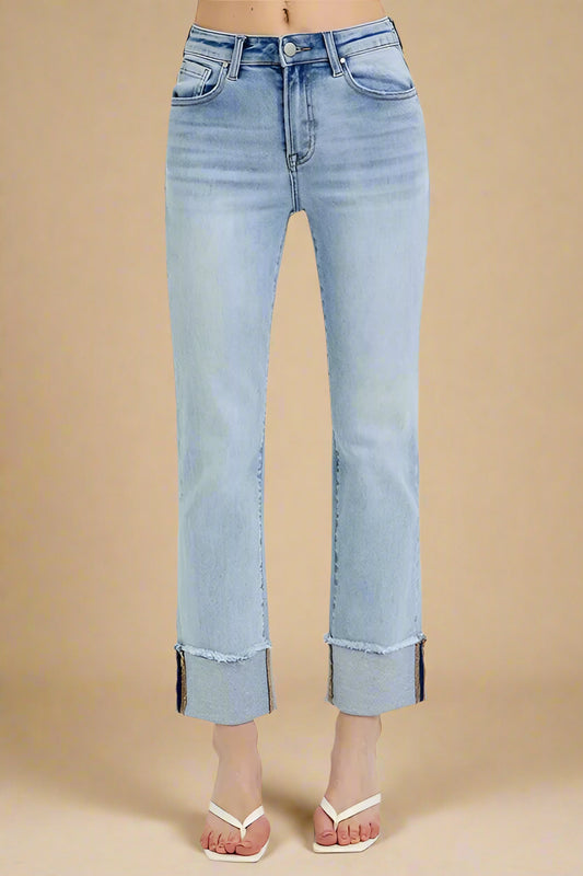 Light blue jeans with a beige background